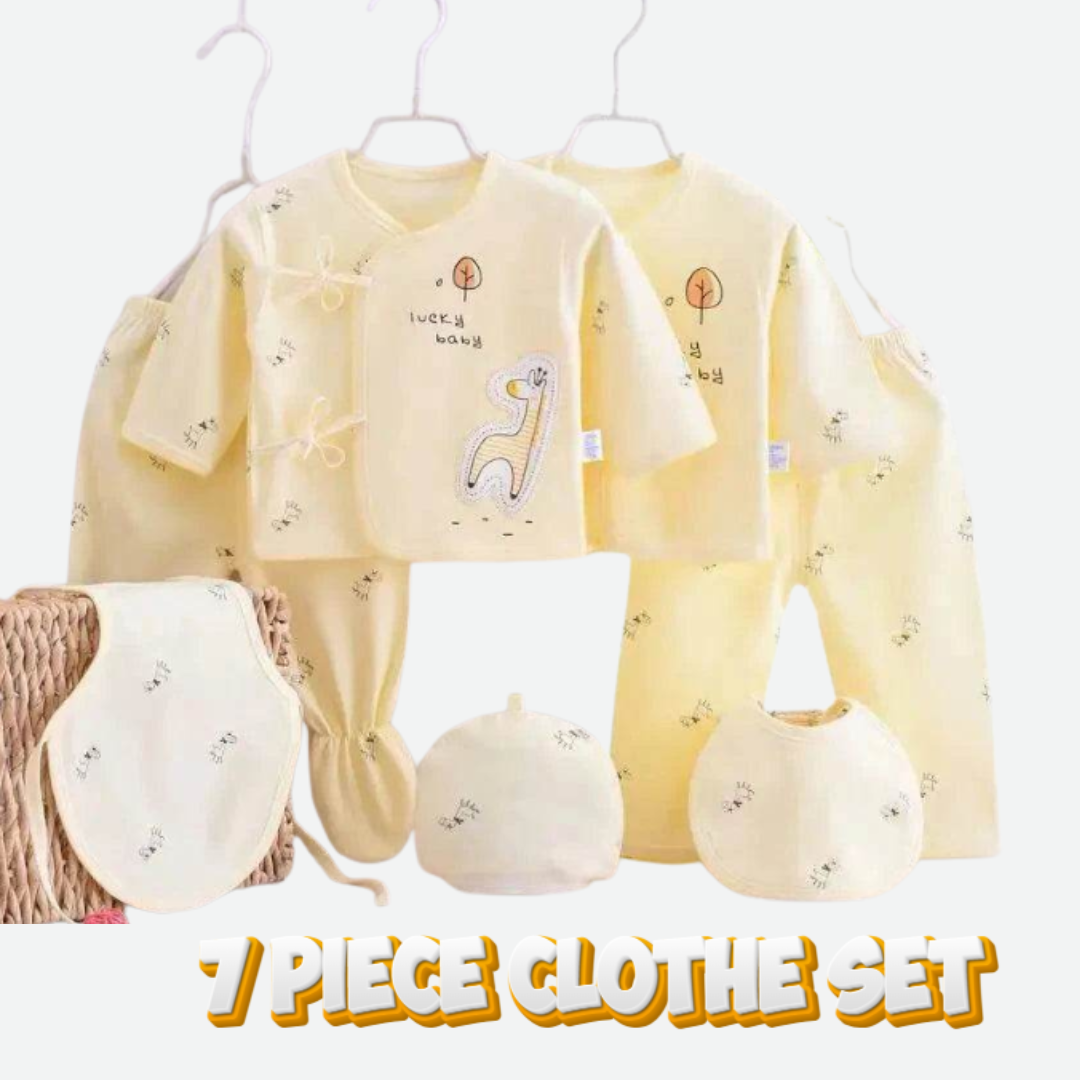 7-piece baby clothes set with yellow top and pants, white bib, and hat on hangers.
