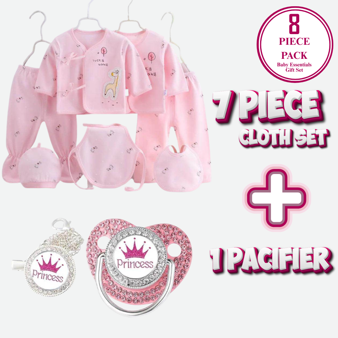 Baby clothing set with pink outfit, pacifier, and 'Princess' accessories on a white background.