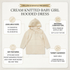 A cream-colored knitted baby girl hooded dress is centered on a light beige infographic background with text callouts about available sizes, material composition, key features, and target audience. The brand name 'WILLOW & WHISTLE PRESENTS' appears at the top.