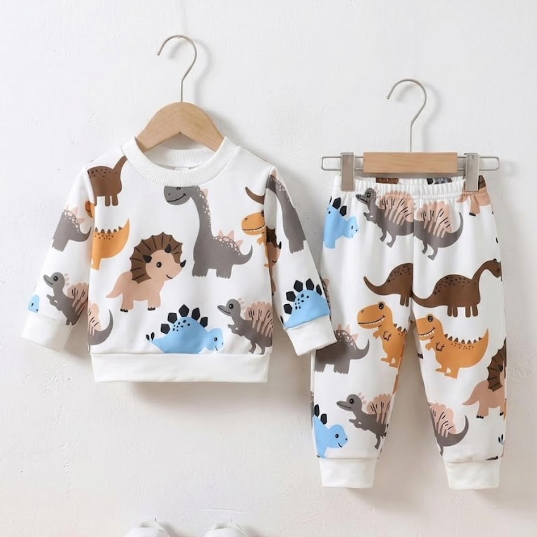 Children's pajama set with dinosaur pattern on a white background