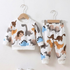 Children's pajama set with dinosaur pattern on a white background