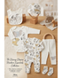 Baby clothing set with Disney character design on a wooden surface