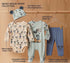 Baby clothing set with Mickey Mouse design on a wooden background