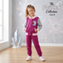 Young girl modeling a Disney Frozen tracksuit from The Frozen Collection in size 8, wearing a magenta hooded button-front jacket with grey sleeves and matching magenta sweatpants against a themed backdrop.