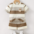 Children's brown and beige striped shirt with bear design on a hanger against a white background