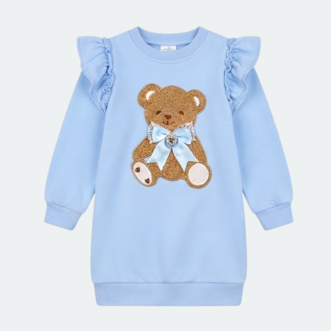 A product information graphic for a toddler girl's long-sleeve peplum T-shirt and printed leggings set by Giorgio Bambini. The set is light pink with a central Eiffel Tower motif and floral applique.