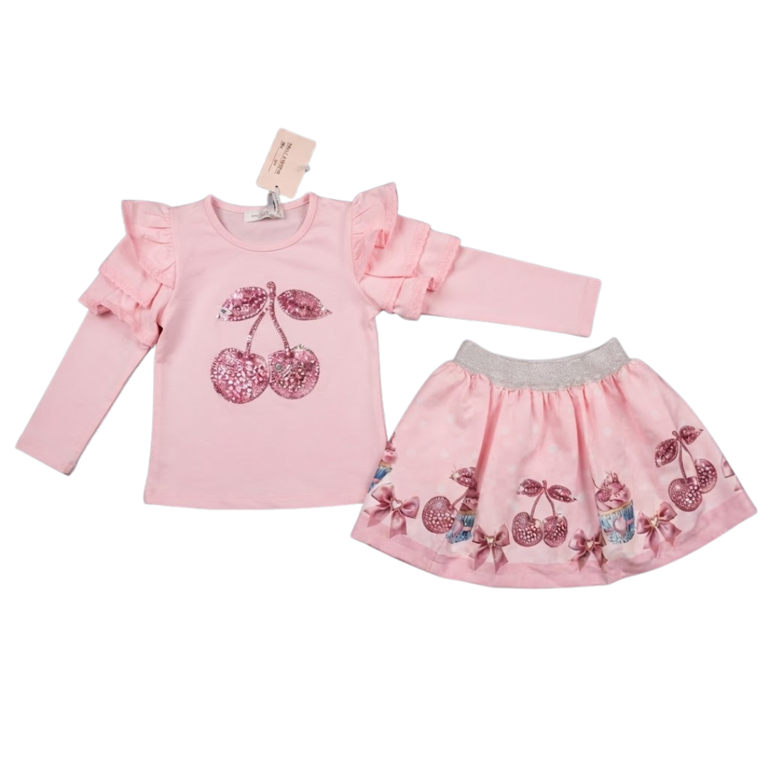 A two-piece baby girl's outfit set in light pink, featuring a long-sleeve top with ruffled sleeves and a cherry sequin graphic, paired with a matching flared skirt with a grey elastic waistband and cherry sequin details.