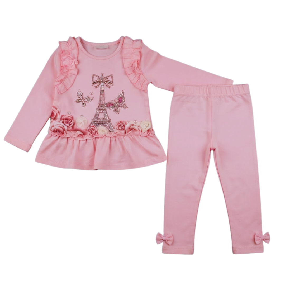 A two-piece girls' outfit set in light pink, featuring a long-sleeve top with ruffle details, a sequined Eiffel Tower design, and 3D floral accents, paired with matching pink leggings that have bow details at the ankles.