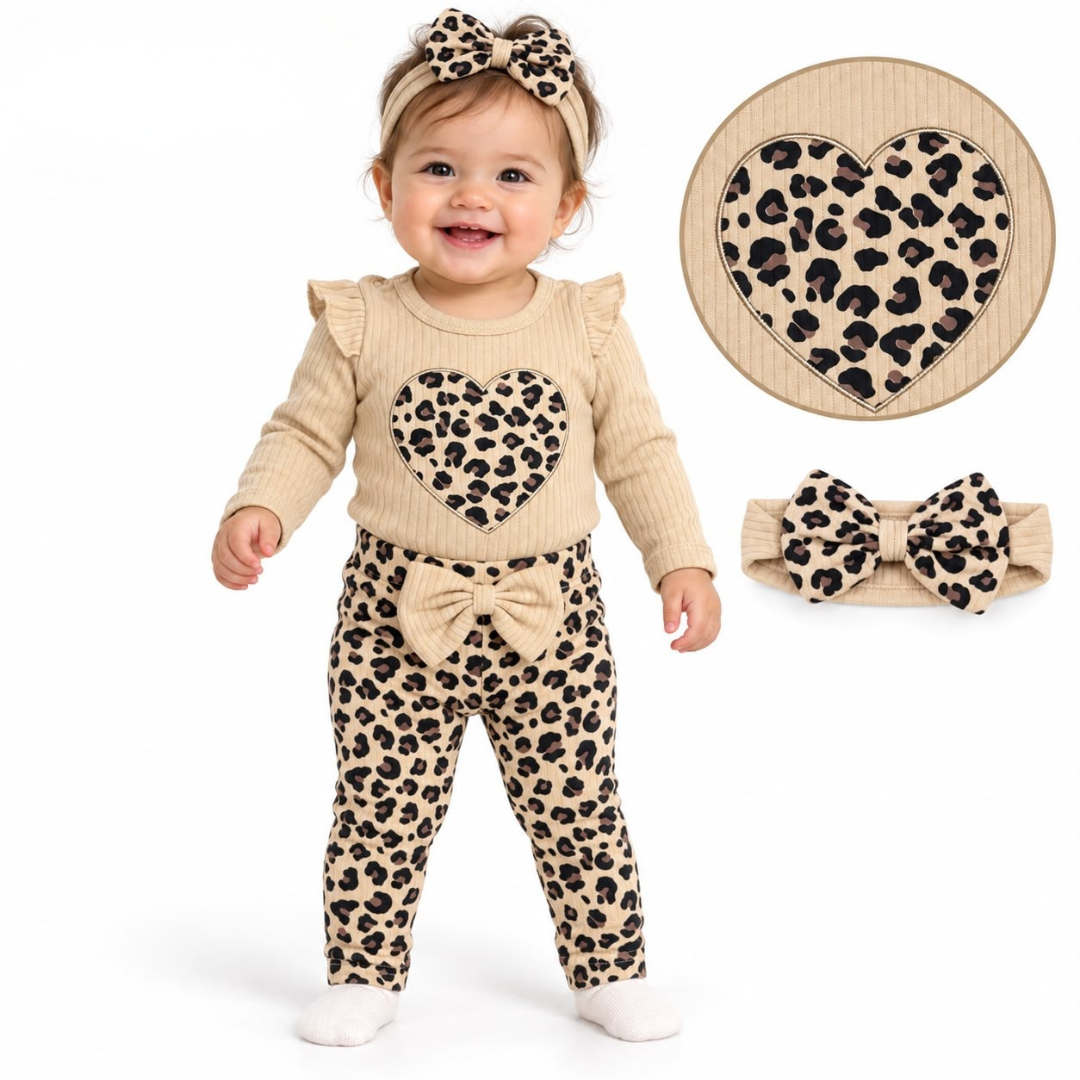 A two-piece children's velour tracksuit in a light beige color, featuring a zip-up hooded jacket and matching wide-leg pants, displayed on hangers against a plain white background.