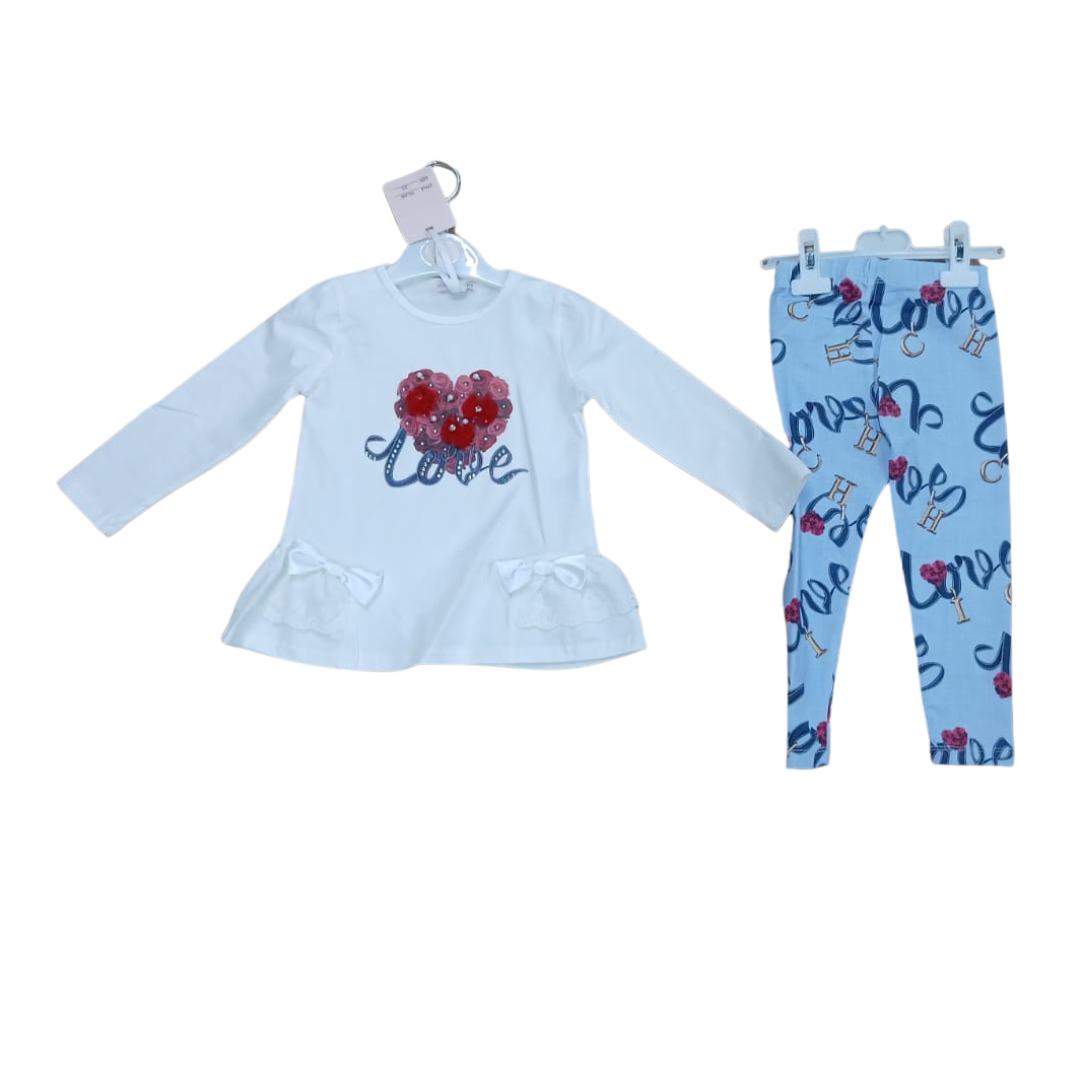 A two-piece children's velour tracksuit in a light beige color, featuring a zip-up hooded jacket and matching wide-leg pants, displayed on hangers against a plain white background.