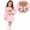 A product infographic for a toddler girls' long-sleeve peplum T-shirt and printed skirt set by Giorgio Bambini. The set is light pink with sequined cherry prints and a small floral motif.