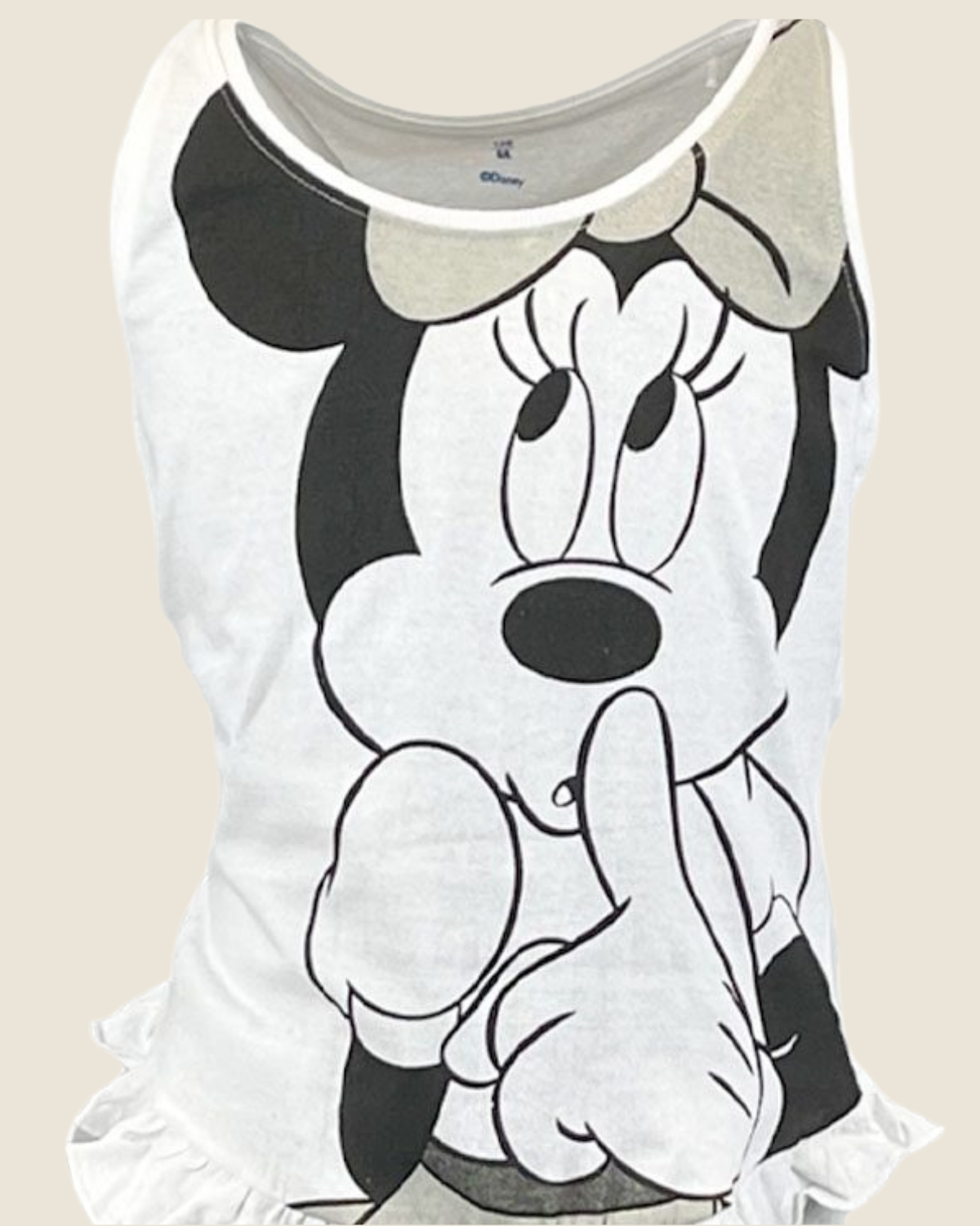 Tank top with a cartoon character design on a beige background