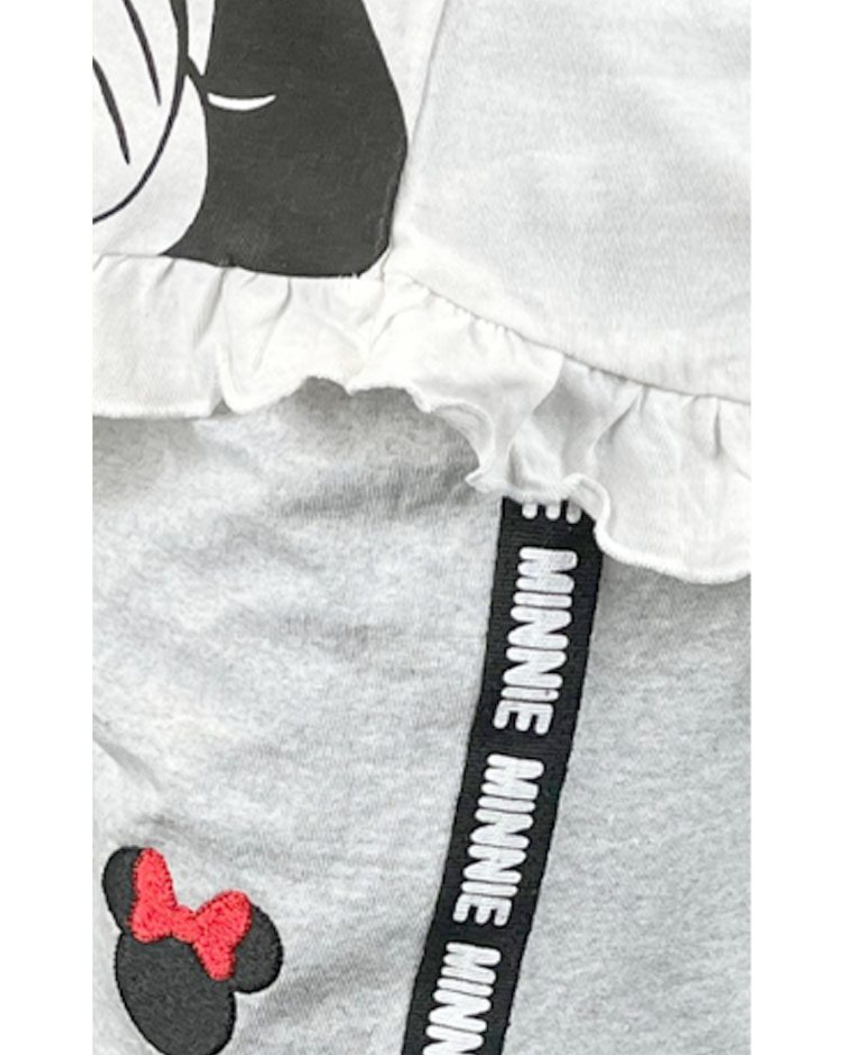 Gray outfit with Minnie Mouse design and text on a white background