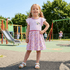 Girl wearing Peppa Pig Character Dress in a playground
