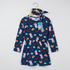 A navy blue long-sleeve Peppa Pig dress with an all-over cartoon print, hanging on a wooden hanger against a light gray background. The dress features a matching fabric headband with a bow, and a Peppa Pig branded paper tag is attached to the neckline.
