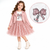 A young girl models a pink sequined tulle skirt with a white graphic tee and a pink faux-leather jacket, shown against a white background with a circular detail inset of the shirt's bow design.