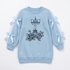 A light blue long-sleeve sweatshirt for girls, featuring a central Eiffel Tower design embellished with rhinestones and roses, and sheer tulle sleeves with light blue ribbon bows.