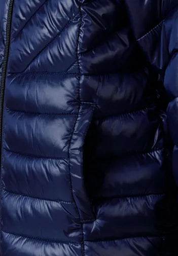 Close-up of a blue puffer jacket with quilted texture