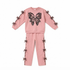 A two-piece kids' loungewear set in dusty pink, featuring a sweatshirt with a large black leopard-print butterfly graphic on the chest and matching pants with decorative butterfly embellishments along the side seams.