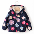 A navy blue hooded jacket for toddlers, featuring a colorful floral pattern in pink, purple, and light blue. The jacket has a soft beige fleece lining visible inside the hood and is displayed on a wooden hanger against a plain white background.