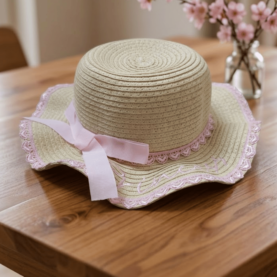  Baby Girls Princess Straw Hat & Bow on the table