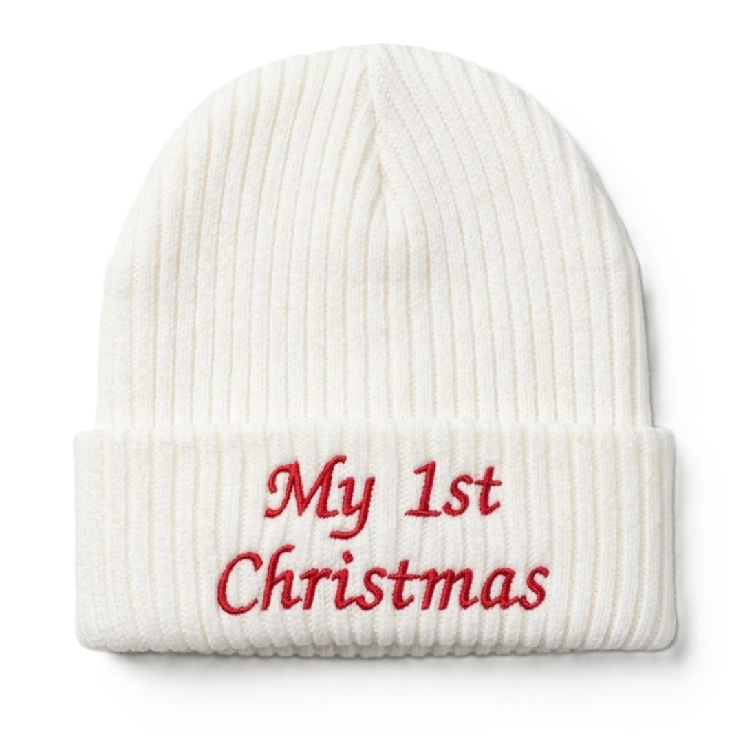 White ribbed knit baby beanie with red embroidered text "My 1st Christmas