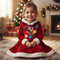 A young girl sits smiling on a rug in a cozy living room, wearing a red Christmas-themed dress with white faux-fur trim and a festive teddy bear graphic on the front.