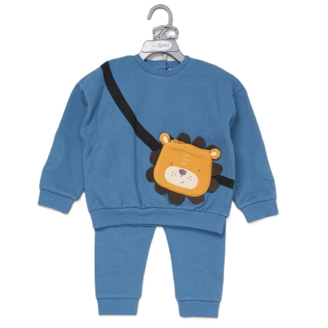 A toddler two-piece sweatshirt and pants set in medium blue, featuring a playful lion-face crossbody bag with a black strap on the front, hanging on a white hanger against a plain white background.