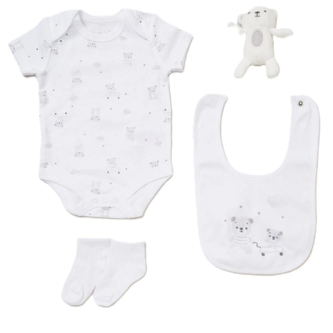 Baby clothing set with onesie, bib, socks, and plush toy on a white background