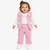 A toddler girl wearing a pink textured knit vest and matching pants over a white long-sleeve shirt, standing against a plain white background.