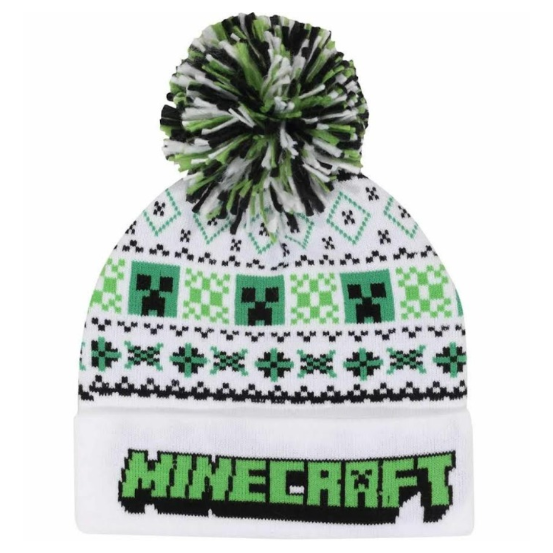 White winter beanie featuring green Minecraft Creeper faces and fair isle patterns, a green and black fluffy pom-pom, and the "MINECRAFT" logo embroidered on the fold-over cuff.
