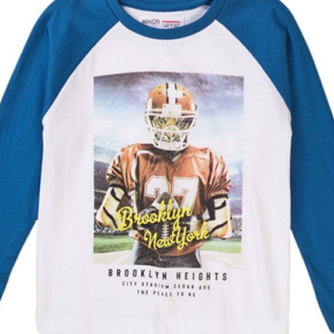 A kids' raglan long-sleeve shirt with a white body and blue sleeves, featuring a large graphic print of a football player on the front with the text 'Brooklyn New York' and 'Brooklyn Heights'.