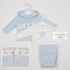 A baby clothing set displayed on white hangers against a light gray background, featuring a light blue hooded sweatshirt with a white embroidered chest panel, a white long-sleeve top with blue 'Prince' lettering, light blue pants, and inset detail views showing the chest embroidery and a close-up of the hood.