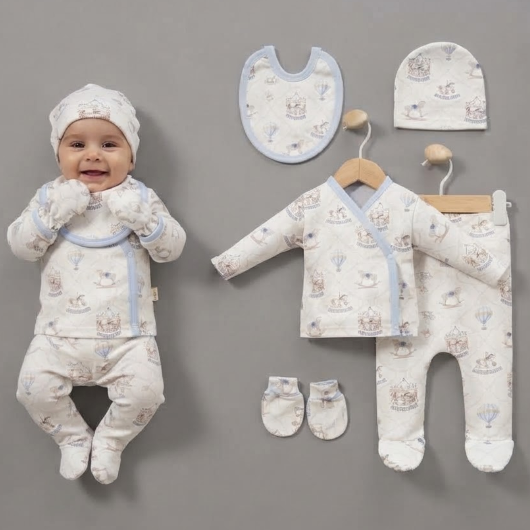 A baby outfit set displayed on a neutral gray background, featuring a smiling baby wearing a matching footed sleeper and bonnet, alongside the laid-out components including a footed sleeper, bib, bonnet, and booties.