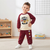 A young boy modeling a two-piece raglan sweatshirt and jogger pants set. The set features a cream-colored body and dark burgundy sleeves on the sweatshirt, with a 'PAW FEEL TEAM' graphic on the chest.