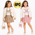 Two young girls modeling matching 4-piece outfits against a white background, featuring a white faux fur jacket with decorative buttons, a white top with a butterfly graphic, a pleated skirt in beige and pink, and a matching handbag. A gold circular badge reads '4PC'.