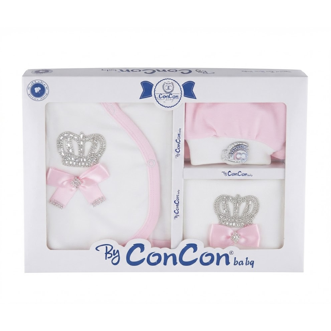 A boxed baby gift set by ConCon, containing a white and pink swaddle blanket, a pink hat, and a white and pink bootie, each decorated with a rhinestone crown and pink bow, presented in a white box with blue branding.