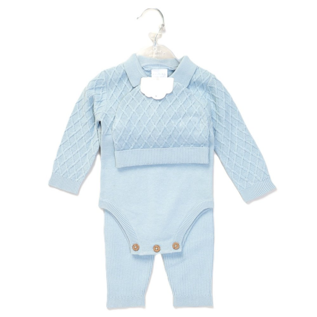 A baby long-sleeve knit romper in light blue, featuring a textured diamond pattern on the upper chest and sleeves, a ribbed collar, and three snap buttons at the crotch, shown hanging on a white plastic hanger against a white background.