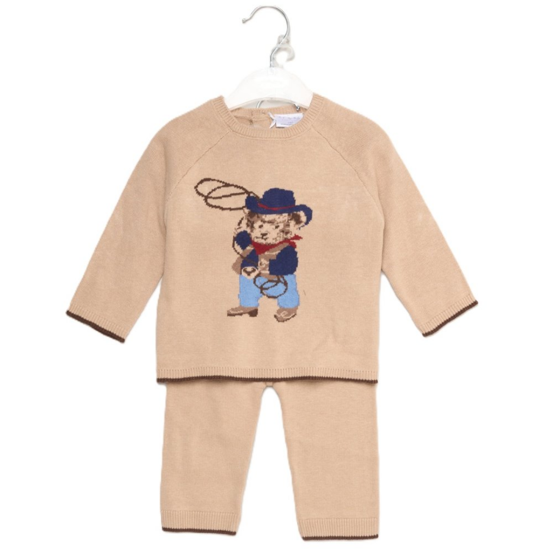 A two-piece baby knit sweater and pants set in beige, featuring a teddy bear cowboy graphic on the chest holding a lasso. The set is displayed on a white hanger against a plain white background.