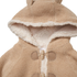 Close-up of a beige knit hooded jacket with a cream sherpa lining and tan toggle closures, shown against a white background.