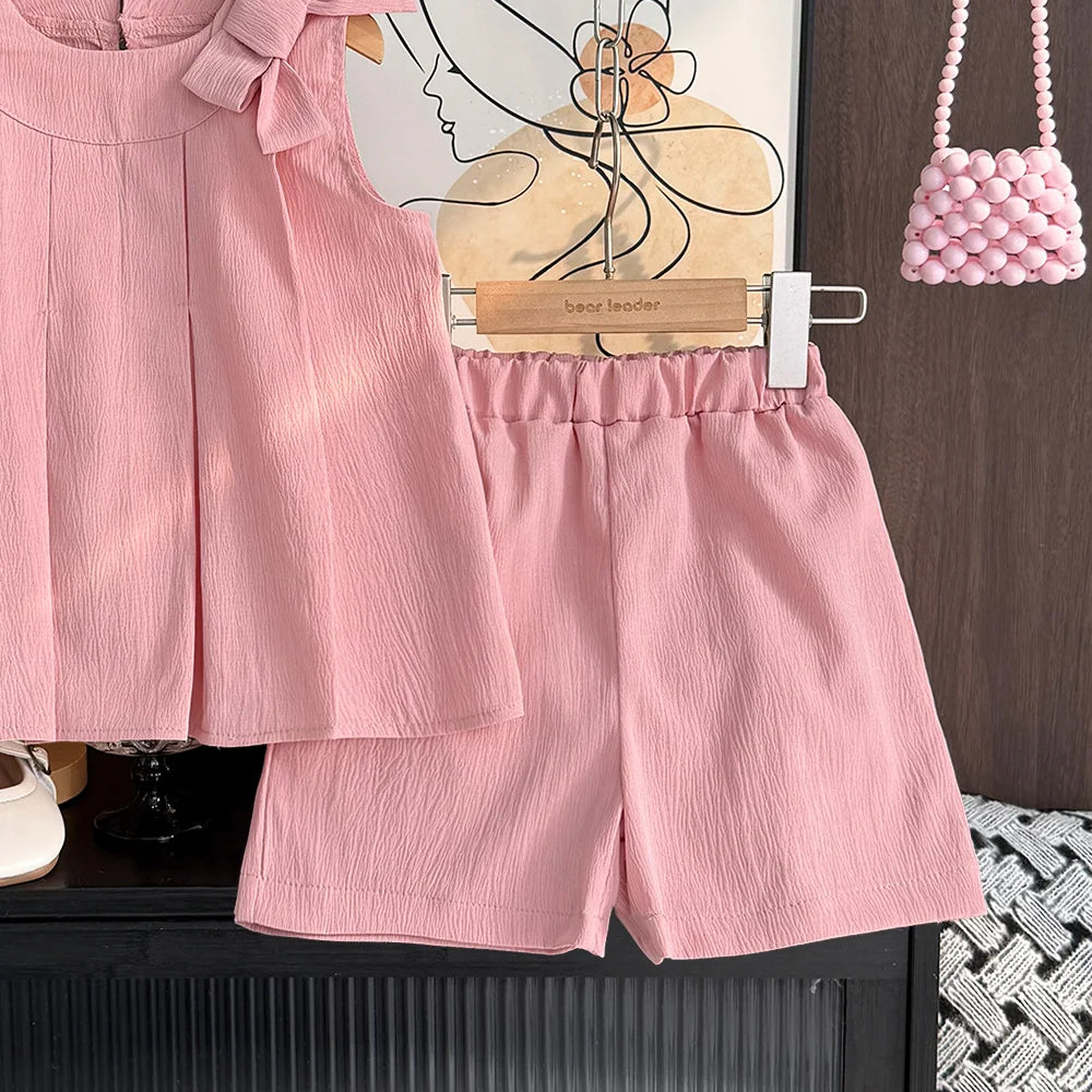 Pink shorts on a hanger with a wooden background