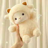 Plush toy resembling a cat in a sheep costume held against a light curtain background
