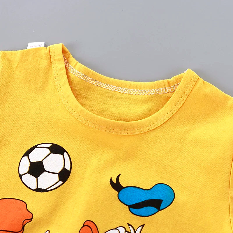 Yellow sleeveless top with cartoon designs on a gray background