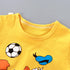 Yellow sleeveless top with cartoon designs on a gray background