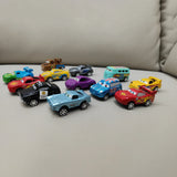 Collection of colorful toy cars on a light surface