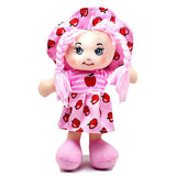 Plush toy with pink outfit and matching hat featuring red apple designs on a white background