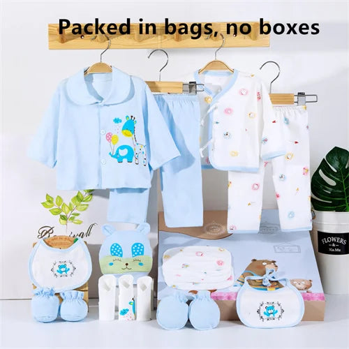 Baby clothing set with cartoon designs on hangers and packaging boxes.