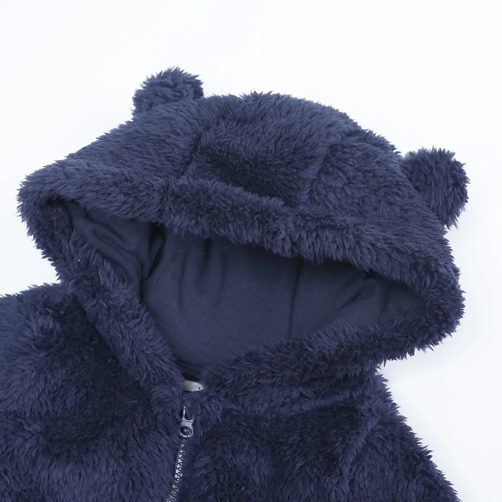 Navy blue fluffy hooded outfit on a white background