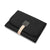 Black clutch bag with a beige strap on a white background