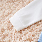 Roll of white paper on a textured pink surface